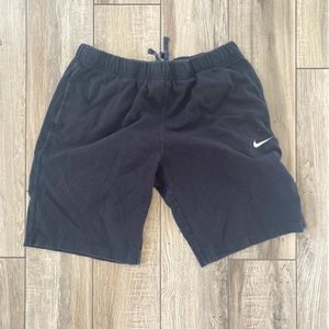 These are Nike black sweat-shorts in a size Large
